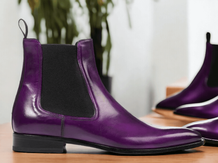 Expertly handcrafted, these Purple Chelsea Boots are the perfect combination of style and durability. Made with high-quality leather, these ankle-high boots are perfect for any party, providing both comfort and fashion. Elevate your wardrobe with these chic and versatile boots.