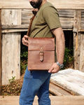 16-inch laptop satchel with adjustable leather strap and handle