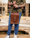 Weatherproof leather travel bag with secure clasps