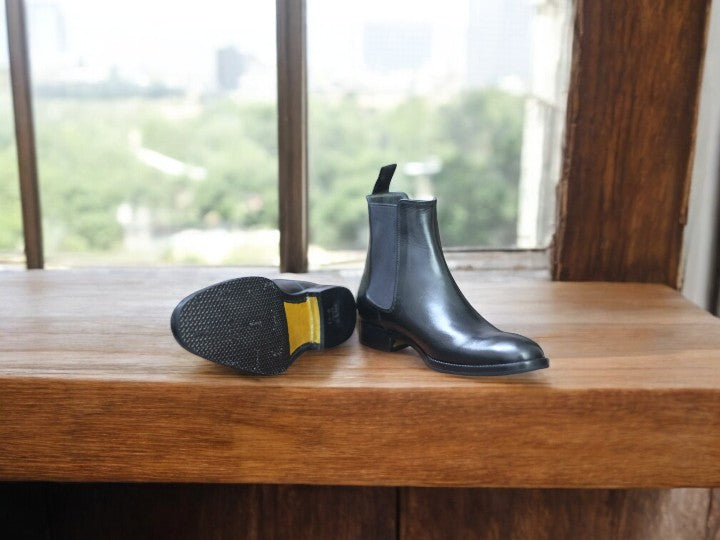 Classic black leather Chelsea boots with pull tab