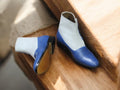 Handcrafted blue white men’s cap toe leather button boots