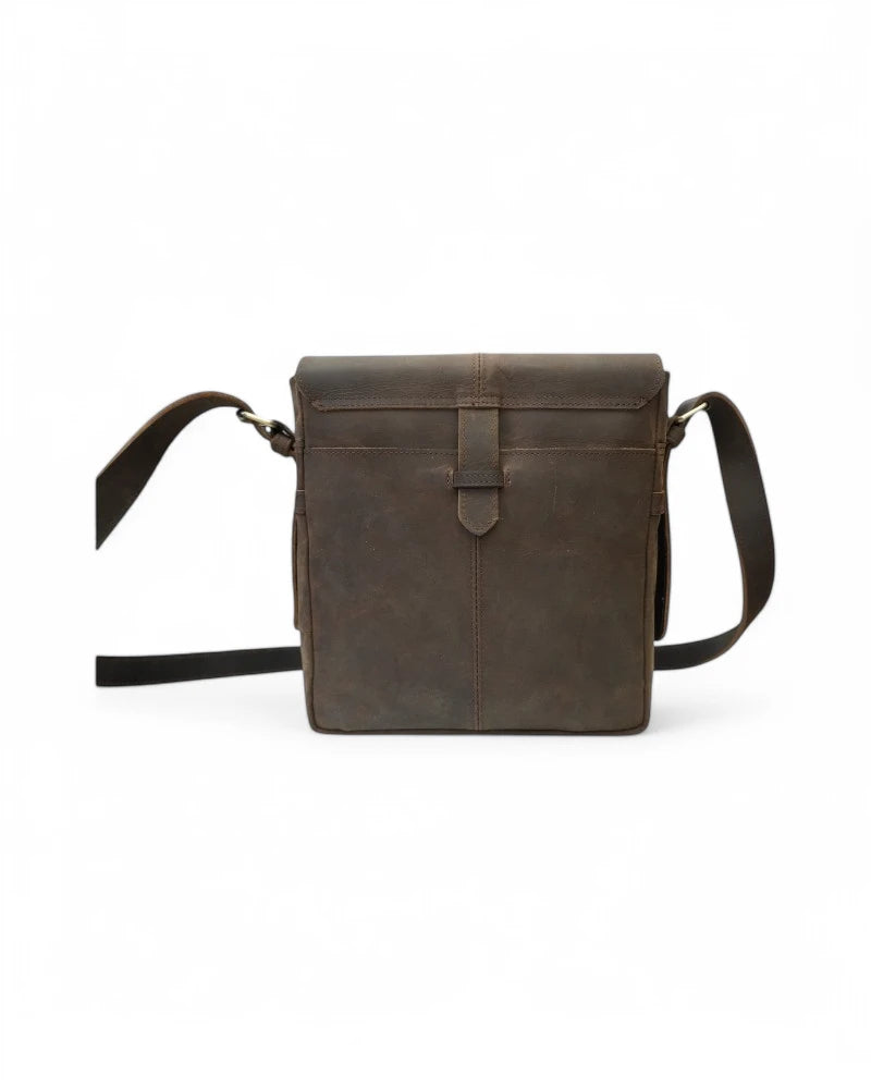 Personalized monogram engraving on leather satchel close-up