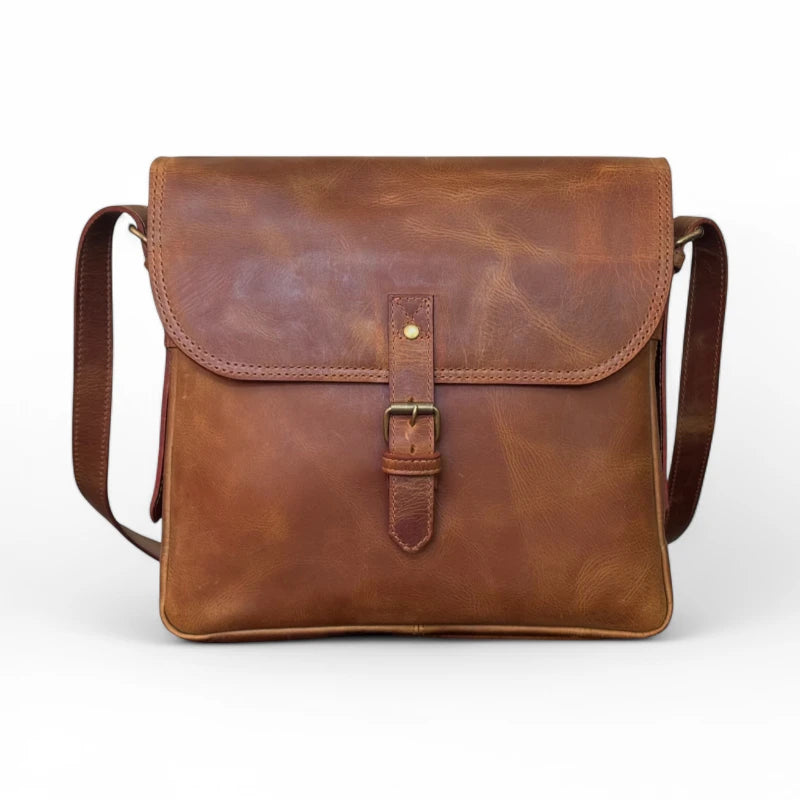 Front view of the leather crossbody bag – Showcasing the stylish saddle brown finish with a secure tick lock closure.