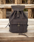 Side angle showcasing leather texture and stitching.