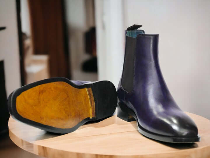 Expertly crafted by hand, these Navy Blue Chelsea Leather Boots are the perfect blend of style and comfort. Slip them on effortlessly and enjoy the durability and sleek design of these ankle boots. Elevate your wardrobe with these high-quality, handmade boots.
