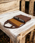 Brown leather crossbody laptop bag with reinforced stitching