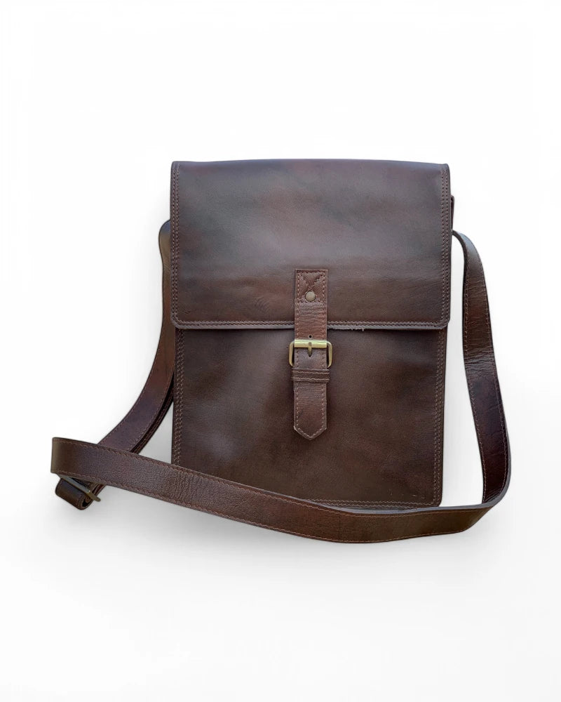 Front View – Full-grain leather messenger bag in rich brown, featuring a classic flap closure and sleek design.

