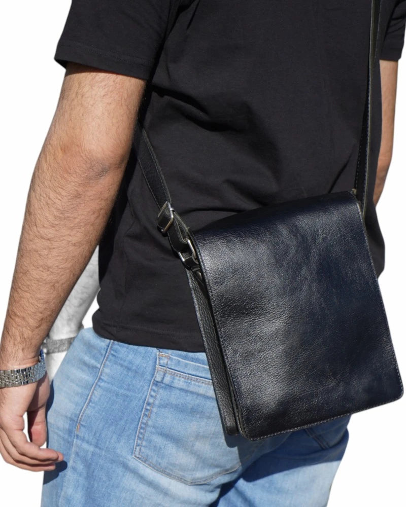 Front view of a sleek black leather messenger bag