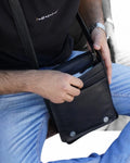 Classic black leather messenger bag with adjustable strap
