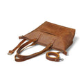 Adjustable leather shoulder strap for versatile carrying options.


